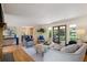 Bright living room with hardwood floors, stylish furnishings, and natural light streaming through large windows at 5196 S Williams Dr, Greenwood Village, CO 80121