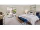 Comfortable main bedroom with a sliding glass door leading to a private outdoor patio area at 5196 S Williams Dr, Greenwood Village, CO 80121
