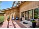 Outdoor patio area features brick flooring, comfortable seating, and stylish decor for relaxation at 5196 S Williams Dr, Greenwood Village, CO 80121