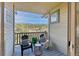 Relaxing balcony with wooded view, furniture, and plenty of natural light provides a cozy space at 31101 Black Eagle Dr # 202, Evergreen, CO 80439