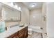 Cozy bathroom featuring a granite countertop bowl sink vanity, a bathtub shower combo and neutral paint at 31101 Black Eagle Dr # 202, Evergreen, CO 80439