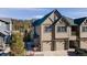 Inviting two-story townhome featuring a two-car garage and well-maintained landscaping at 31101 Black Eagle Dr # 202, Evergreen, CO 80439