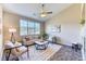 Inviting living room featuring a large window with natural light and modern furnishings at 31101 Black Eagle Dr # 202, Evergreen, CO 80439