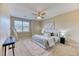 Comfortable main bedroom featuring plush carpet, a large window with blinds, and contemporary decor at 31101 Black Eagle Dr # 202, Evergreen, CO 80439