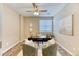 Stylish office with a contemporary rug, a large window with blinds, a ceiling fan, and modern decor at 31101 Black Eagle Dr # 202, Evergreen, CO 80439
