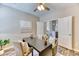 Bright office featuring hardwood floors, neutral paint, modern desk and decor, with views to the home's interior at 31101 Black Eagle Dr # 202, Evergreen, CO 80439