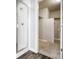 Bright bathroom showing the glass enclosed tiled shower and walk-in closet at 16069 E Elk Dr, Denver, CO 80239