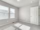 Well-lit bedroom with plush carpet, and natural lighting through two large windows at 16069 E Elk Dr, Denver, CO 80239