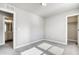 Bright bedroom with neutral carpet, base trim, and access to closet and bathroom at 16069 E Elk Dr, Denver, CO 80239