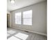 Bright bedroom with neutral walls, two windows, and carpeted floors at 16069 E Elk Dr, Denver, CO 80239