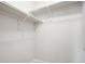 White shelving in a walk-in closet offering ample storage space at 16069 E Elk Dr, Denver, CO 80239