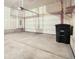 Spacious two-car garage with concrete flooring and an automatic door opener for easy access at 16069 E Elk Dr, Denver, CO 80239