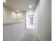 Hallway with neutral walls and carpeted floors leading to other rooms at 16069 E Elk Dr, Denver, CO 80239