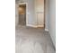 Neutral-colored hallway featuring an open doorway and carpet flooring at 16069 E Elk Dr, Denver, CO 80239