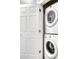 White stacked washer and dryer, near a closed door at 16069 E Elk Dr, Denver, CO 80239