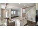 Living room with hardwood floors, granite kitchen island, and ample natural light at 16069 E Elk Dr, Denver, CO 80239