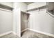 Bright, carpeted walk-in closet with white walls and shelves at 16069 E Elk Dr, Denver, CO 80239
