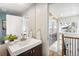 Powder room features a vessel sink, wood vanity, and an adjacent view of a stairway at 31969 Robinson Hill Rd, Golden, CO 80403