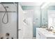 Bright bathroom features a shower and a view into an open doorway to the house's interior at 31969 Robinson Hill Rd, Golden, CO 80403