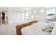 Bright bedroom with large windows, and neutral carpet at 31969 Robinson Hill Rd, Golden, CO 80403