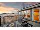 Outdoor deck with scenic views, lounge seating, and home's exterior at 31969 Robinson Hill Rd, Golden, CO 80403