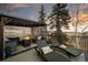 Relaxing deck features comfortable seating, a fire pit, and scenic views for outdoor enjoyment at 31969 Robinson Hill Rd, Golden, CO 80403