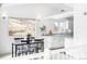 Dining area with view and white cabinets in an open concept floor plan at 31969 Robinson Hill Rd, Golden, CO 80403