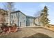 Stunning home exterior showcasing ample parking, contemporary design, and large windows for lots of natural light at 31969 Robinson Hill Rd, Golden, CO 80403