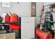 Tesla Powerwall in a well-stocked garage shows energy efficiency and organization at 31969 Robinson Hill Rd, Golden, CO 80403