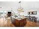 Beautiful kitchen island with sink, granite countertops, and stainless steel microwave at 31969 Robinson Hill Rd, Golden, CO 80403