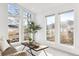 Bright living room with comfortable seating, large windows, and natural light at 31969 Robinson Hill Rd, Golden, CO 80403