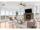 Bright living room features vaulted ceilings, a stone fireplace, and large windows with mountain views at 31969 Robinson Hill Rd, Golden, CO 80403