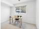 Bright office space with a large window, a desk, and chair, offering a functional and peaceful work environment at 31969 Robinson Hill Rd, Golden, CO 80403