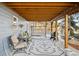 Relaxing covered outdoor patio features seating, a grill, and a charming swing, perfect for enjoying the outdoors at 31969 Robinson Hill Rd, Golden, CO 80403