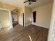A light-filled bedroom features new flooring, closet space, and an area that needs TLC at 723 Newton St, Denver, CO 80204