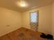 Bedroom featuring hardwood floors, neutral paint, and a window at 723 Newton St, Denver, CO 80204