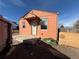 A compact home with a covered entryway and natural light requires landscaping and TLC at 723 Newton St, Denver, CO 80204