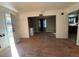 A cozy living room features hardwood floors and an open doorway that leads to the kitchen at 723 Newton St, Denver, CO 80204