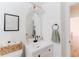 Bathroom featuring a modern vanity with decorative mirror, stylish lighting, and ample counter space, creating a sophisticated design at 4172 Deer Watch Dr, Castle Rock, CO 80104