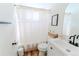 Bathroom features a vanity with a decorative sink and toilet, creating a cozy and functional space at 4172 Deer Watch Dr, Castle Rock, CO 80104