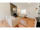 Inviting living room with a modern fireplace, ample seating, and lots of natural light at 4172 Deer Watch Dr, Castle Rock, CO 80104