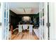 A professional music studio offers inspiration with hardwood floors, recording booth, and french doors at 4172 Deer Watch Dr, Castle Rock, CO 80104