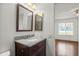 Bathroom showcasing a granite vanity and fixtures at 3512 S Kittredge St # A, Aurora, CO 80013