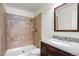 Bathroom showcasing tiled shower, vanity and fixtures at 3512 S Kittredge St # A, Aurora, CO 80013