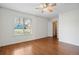 Bedroom with wood floors, ceiling fan and window views at 3512 S Kittredge St # A, Aurora, CO 80013