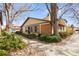 Inviting home with a tan exterior, brick accents, and mature landscaping at 3512 S Kittredge St # A, Aurora, CO 80013