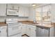 Efficient kitchen with white cabinetry and stainless steel appliances at 3512 S Kittredge St # A, Aurora, CO 80013