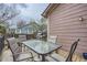Outdoor living space with a table and chairs overlooking the backyard and other homes at 8426 W 97Th Pl, Broomfield, CO 80021