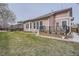 View of a fully fenced backyard with deck, patio, and lawn at 8426 W 97Th Pl, Broomfield, CO 80021