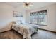 Comfortable bedroom with a large window and ceiling fan at 8426 W 97Th Pl, Broomfield, CO 80021